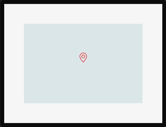 A dropped Map marker: a small red pin icon on a plain map.