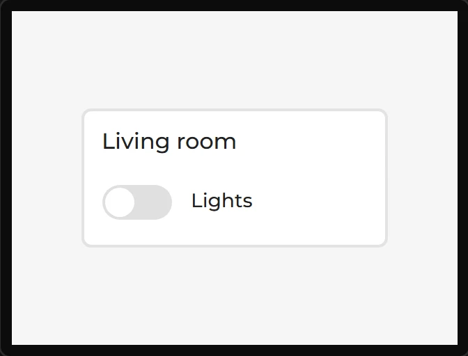 A white card on the screen with the heading Living room and a switch with the word Lights beside it.