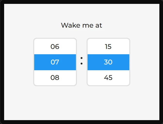 Two rollers side by side under the words Wake me at: hours with 07 lit, minutes with 30 lit, and a colon between them.